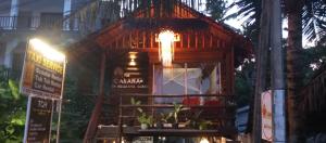 a tree house with a chandelier on top of it at The Cabana on hiriketiya beach dikwella in Dickwella