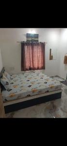 Ένα ή περισσότερα κρεβάτια σε δωμάτιο στο Jay mahadev