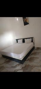 Ένα ή περισσότερα κρεβάτια σε δωμάτιο στο Jay mahadev