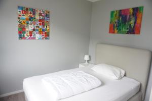 En eller flere senge i et værelse på Kustverhuur, Breskens, Het Heem 69