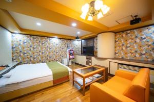 Ένα ή περισσότερα κρεβάτια σε δωμάτιο στο ホテルパティオ +6 φωτογραφίες