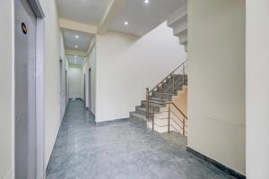 an empty hallway with stairs in a building at Hotel O Meerut Central College Formerly Saffron in Meerut