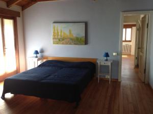 Ένα ή περισσότερα κρεβάτια σε δωμάτιο στο Il Ciliegio Selvatico