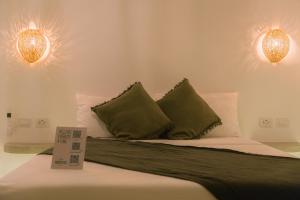 Ένα ή περισσότερα κρεβάτια σε δωμάτιο στο SAMPA El Nido +38 φωτογραφίες