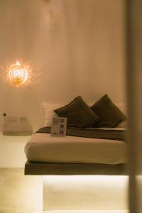 En eller flere senge i et værelse på SAMPA El Nido + 47 billeder