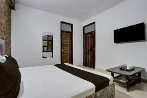 Et tv og/eller underholdning på Super Hotel O Sector 3 Ghaziabad Formerly Cloud Inn + 30 billeder