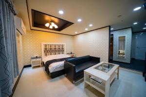 Ένα ή περισσότερα κρεβάτια σε δωμάτιο στο ホテルパティオ