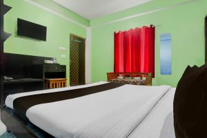 Ένα ή περισσότερα κρεβάτια σε δωμάτιο στο Super Collection O Chhapra Railway Junction Formerly Hotel City Palace +22 φωτογραφίες