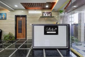 a large sign in front of a building at Collection O Mini Bypass Nellore Road Formerly AMR Guest Inn in Nellore