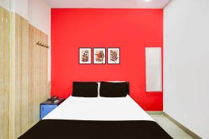 Ένα ή περισσότερα κρεβάτια σε δωμάτιο στο Collection O Sirkazhi Formerly Navagiraga Resort