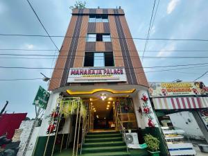 a building with a sign that reads mumbai palace at Hotel O Rajiv Gandhi Bus Stop Bangalore Formerly Maharaja in Jālahalli
