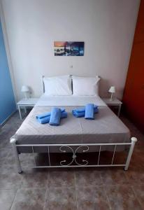 Postel nebo postele na pokoji v ubytování Arigos Apartments