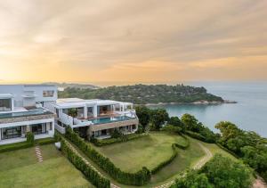 an aerial view of a house with a view of the ocean at Cape Azure Resort Samui by Thalsea in Plai Laem