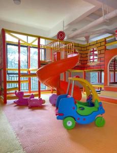 a childs play room with a slide and toy cars at 2 bedrooms apartment in Riverside drive in Nairobi