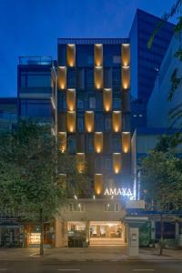 a building with a bunch of lights on it at Amaya Saigon Boutique Hotel in Ho Chi Minh City