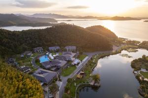 an aerial view of a home on a lake at voco Ningbo Dongqian Lake by IHG in Ningbo