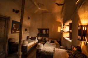 a bedroom with two beds and a ceiling at Siwa Villa in Siwa
