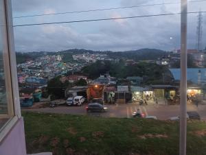 a view of a city from a window of a street at Ooty Gate Residency in Ooty