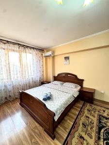 Postel nebo postele na pokoji v ubytování 19 Одна комнатная квартира в центре + 10 fotografií