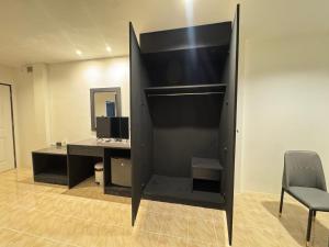 an empty office with a desk and a chair at Chapter 26 in Patong Beach