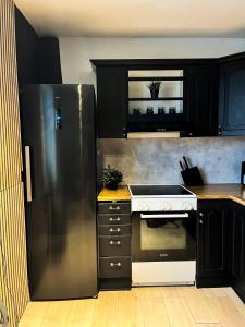 Кухня или мини-кухня в Top floor Helsfyr city central apartment
 +21 фотография