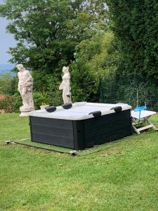 a statue of a woman standing on top of a table at Il rifugio del sole in Barasso