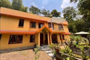 a house with a solar panel on top of it at Sacred Grove Homestay in Kalimpong
