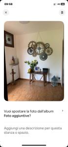 a living room with a table and a chandelier at Il rifugio del sole in Barasso