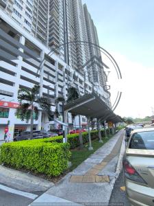 a car parked on a sidewalk next to a building at Razak City Residence at Sungai Besi, Kuala Lumpur by Liberty Homes in Kuala Lumpur