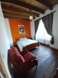 Ένα ή περισσότερα κρεβάτια σε δωμάτιο στο Gîte de Talen