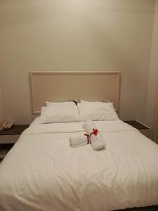 En eller flere senge i et værelse på Rayyan homestay