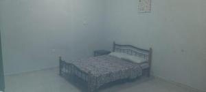 Ένα ή περισσότερα κρεβάτια σε δωμάτιο στο HOUSE IN AL AIN - 4