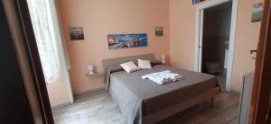 Ένα ή περισσότερα κρεβάτια σε δωμάτιο στο Le Vie del Centro - B&B