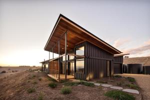 a wooden house on top of a hill at Studio on Forktree – Modern Coastal Retreat in Carrickalinga