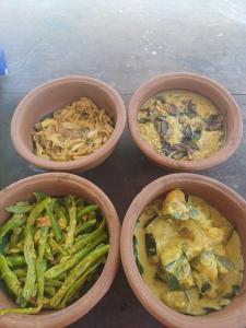 four bowls of food with green beans and pasta at Villa diamond nest in Unawatuna
