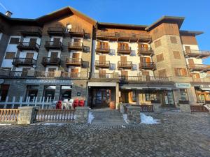 a large building with balconies on the front of it at mountain summit sestriere in Sestriere