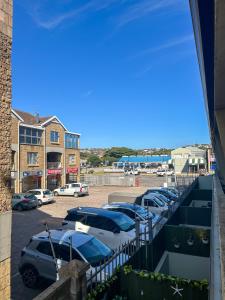 a row of cars parked in a parking lot at Secret Eden in Jeffreys Bay