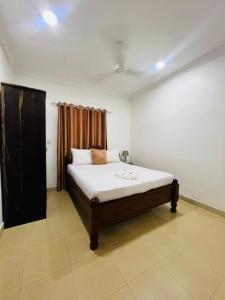 En eller flere senge i et værelse på Vuga Town House