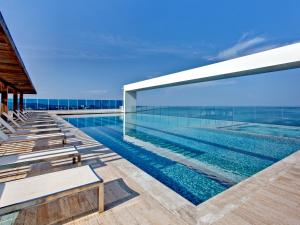 a swimming pool on the roof of a building at Las Americas Torre Del Mar in Cartagena de Indias