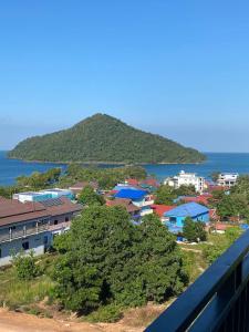 a view of a town with houses and the ocean at Big Head Bungalows in Koh Rong Sanloem