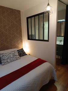 Ένα ή περισσότερα κρεβάτια σε δωμάτιο στο Suite parentale et cuisine