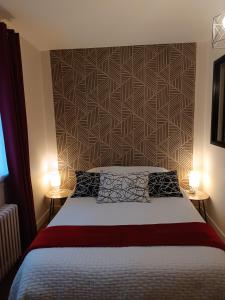 Ένα ή περισσότερα κρεβάτια σε δωμάτιο στο Suite parentale et cuisine