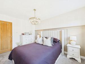 Ένα ή περισσότερα κρεβάτια σε δωμάτιο στο The Haven Holiday Home