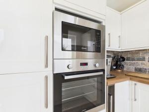 Η κουζίνα ή μικρή κουζίνα στο The Haven Holiday Home