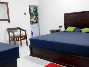 Un pat sau paturi într-o cameră la Amuna Villa