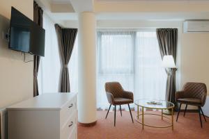 TV a/nebo společenská místnost v ubytování Vila Turistică Fabian