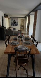 a wooden table with chairs and a dining room at Plus in Logroño
