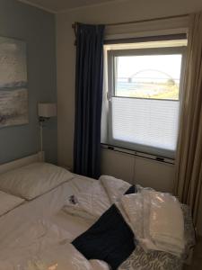 Postel nebo postele na pokoji v ubytování Strandhaus-Appartment-Rauchschwalbe + 12 fotografií