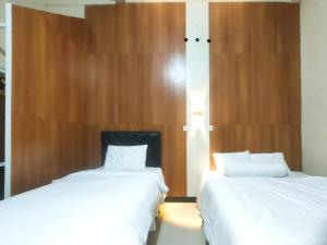 Φωτογραφία από το άλμπουμ του Amore Guesthouse Syariah Mitra RedDoorz σε Garung +20 φωτογραφίες