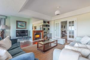 Et opholdsområde på Moradia Milú frente à praia